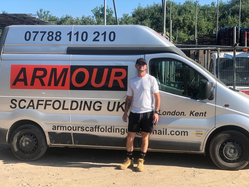 Ray from Armour Scaffolding UK standing beside the company van